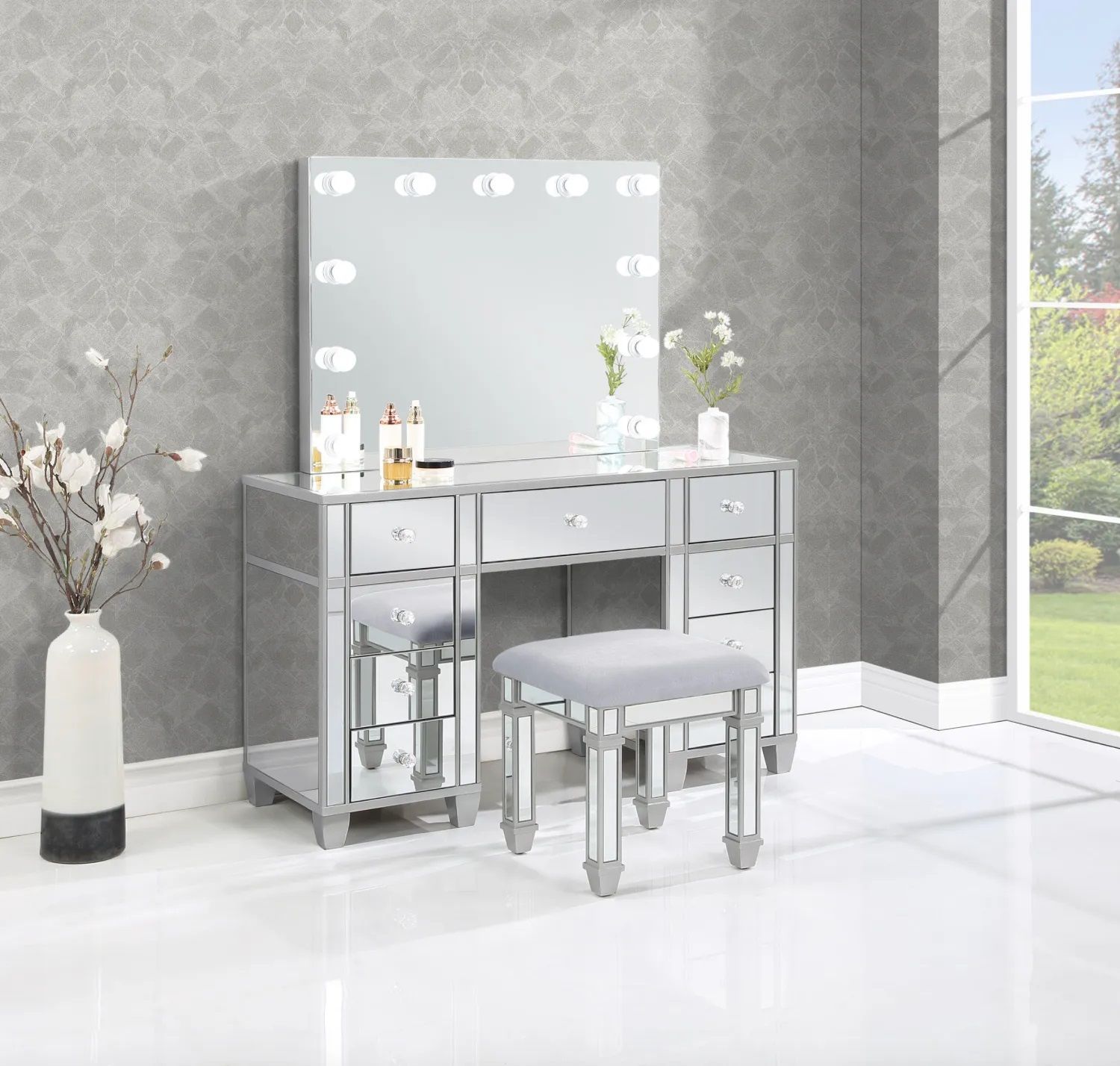 A vanity with a mirror and a stool in a room