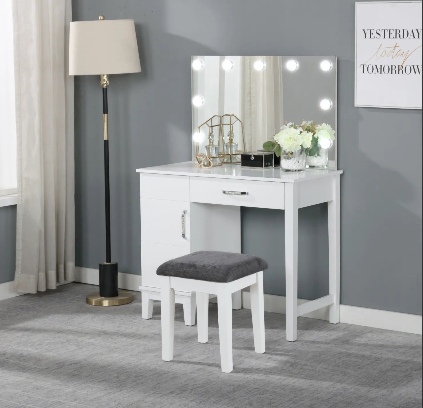 A vanity with a mirror and a sign that says yesterday today and tomorrow