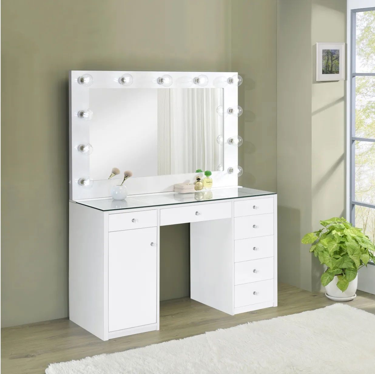 A white vanity with a mirror and lights on it