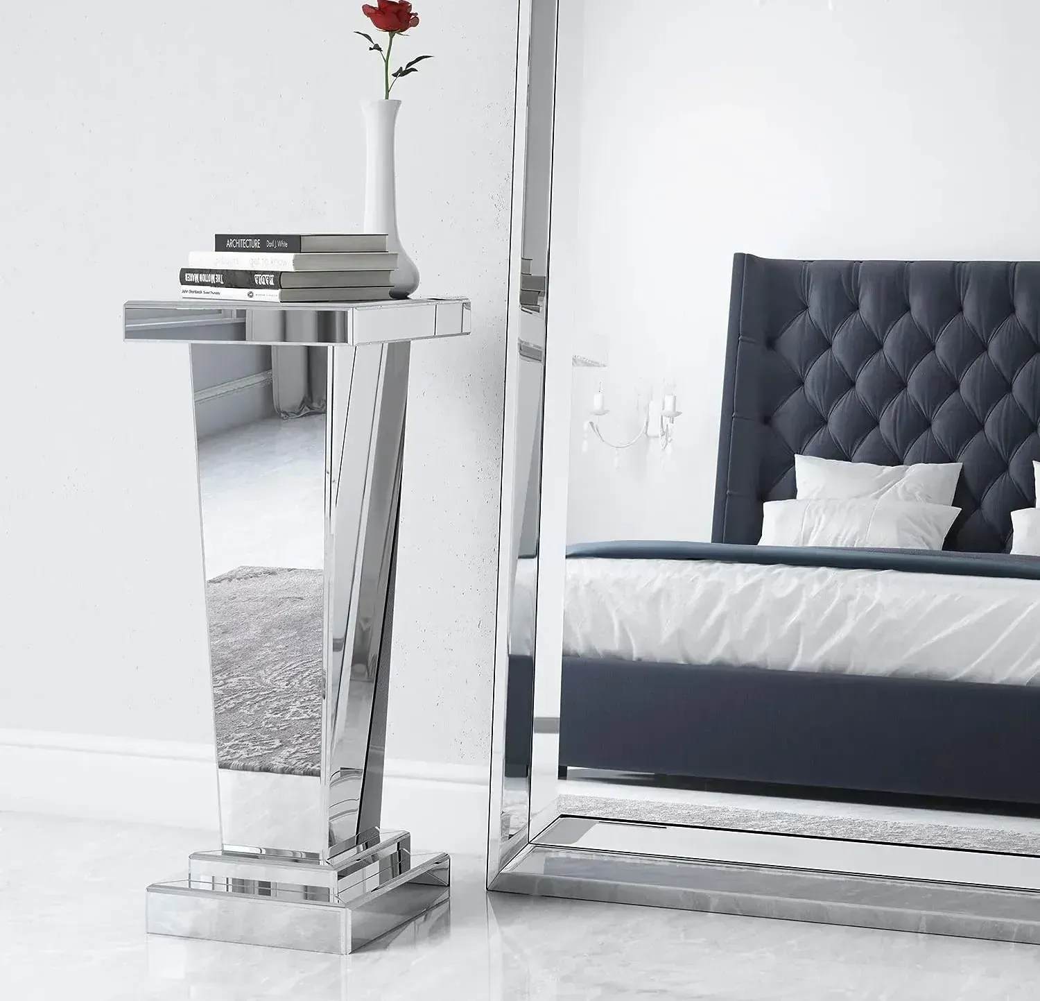 A bedroom with a large mirror and a bed
