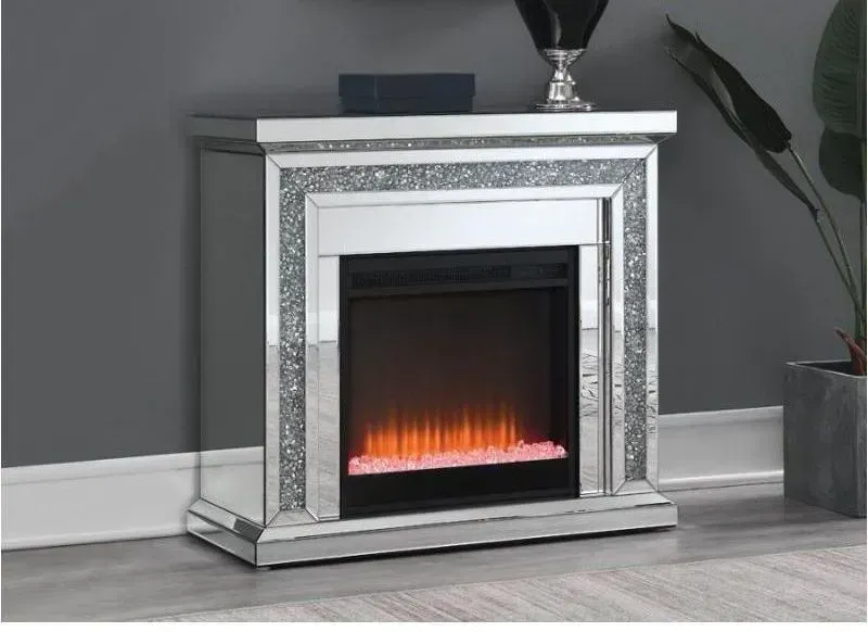 A fireplace is sitting in a living room next to a plant