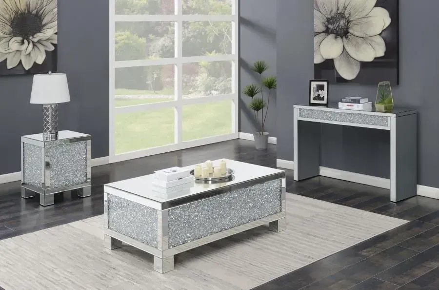 A living room with a coffee table , nightstand , and console table.