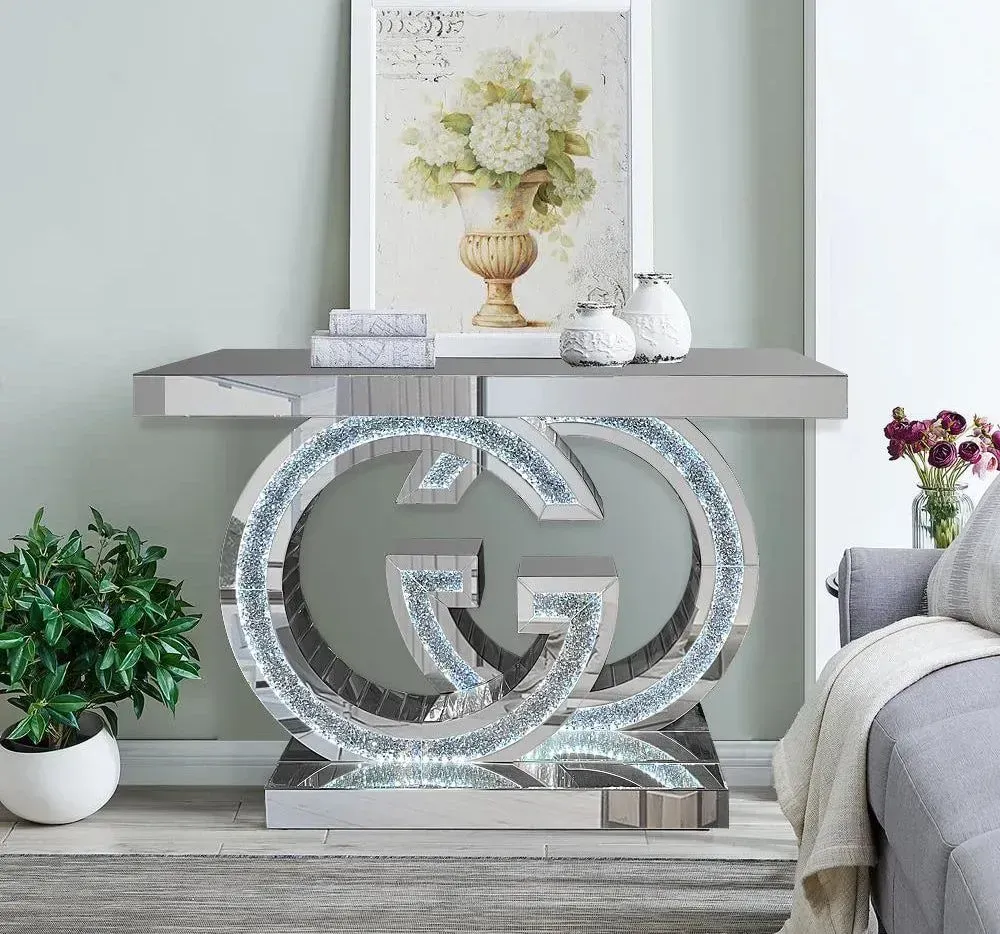 A living room with a couch and a table with a g on it