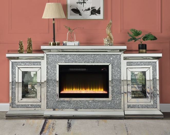 A living room with a fireplace and a lamp