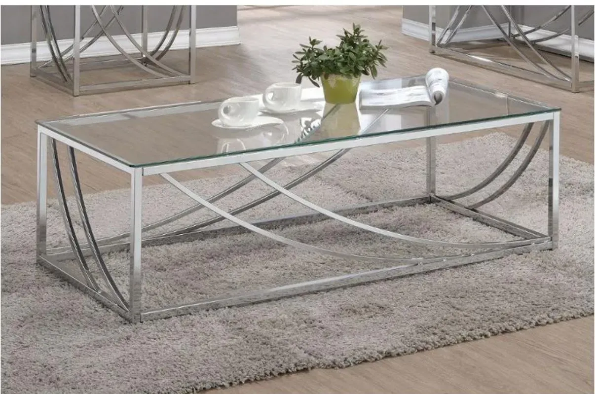 A glass coffee table with a plant on top of it
