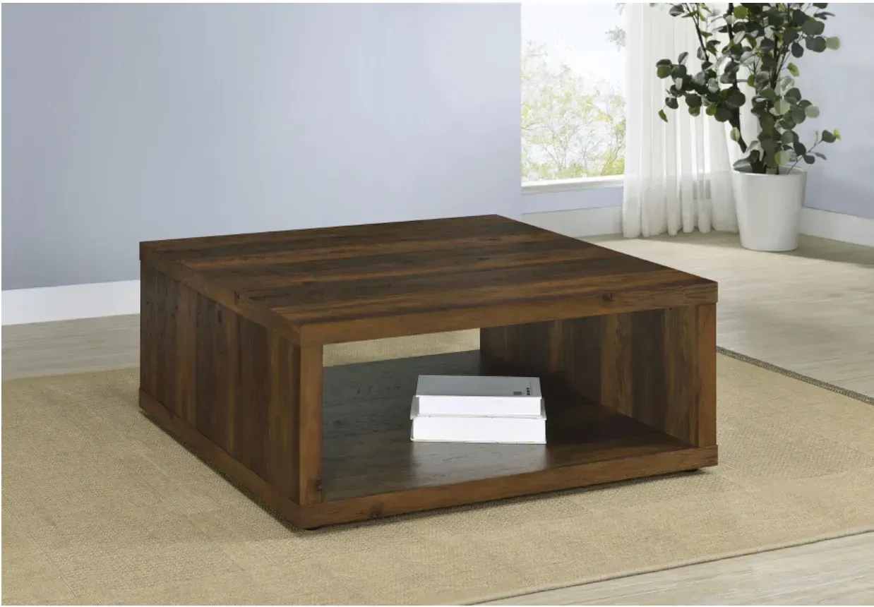 A wooden coffee table with a shelf underneath it