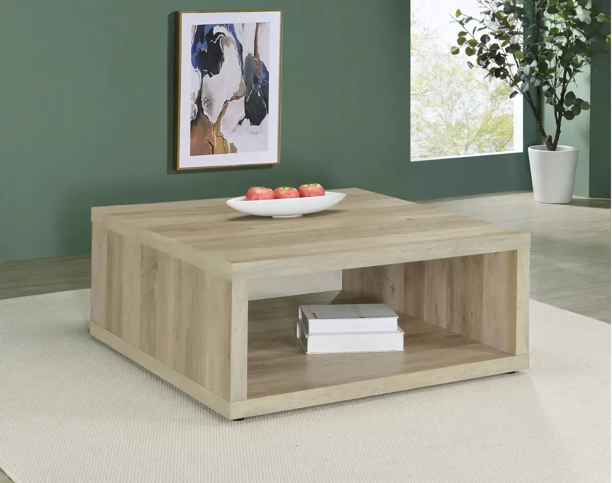 A wooden coffee table with a bowl of apples on it