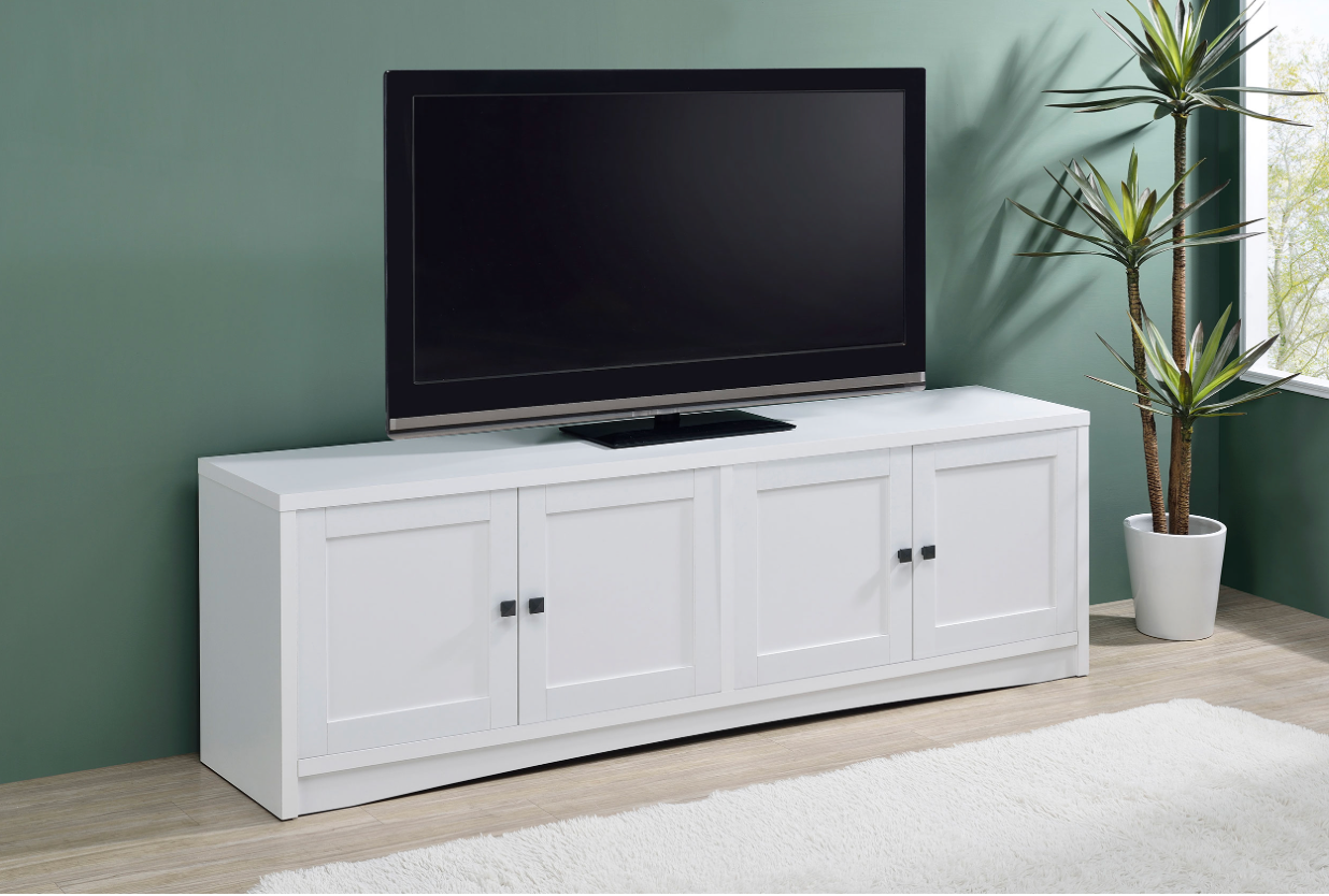 A flat screen tv is sitting on top of a white entertainment center