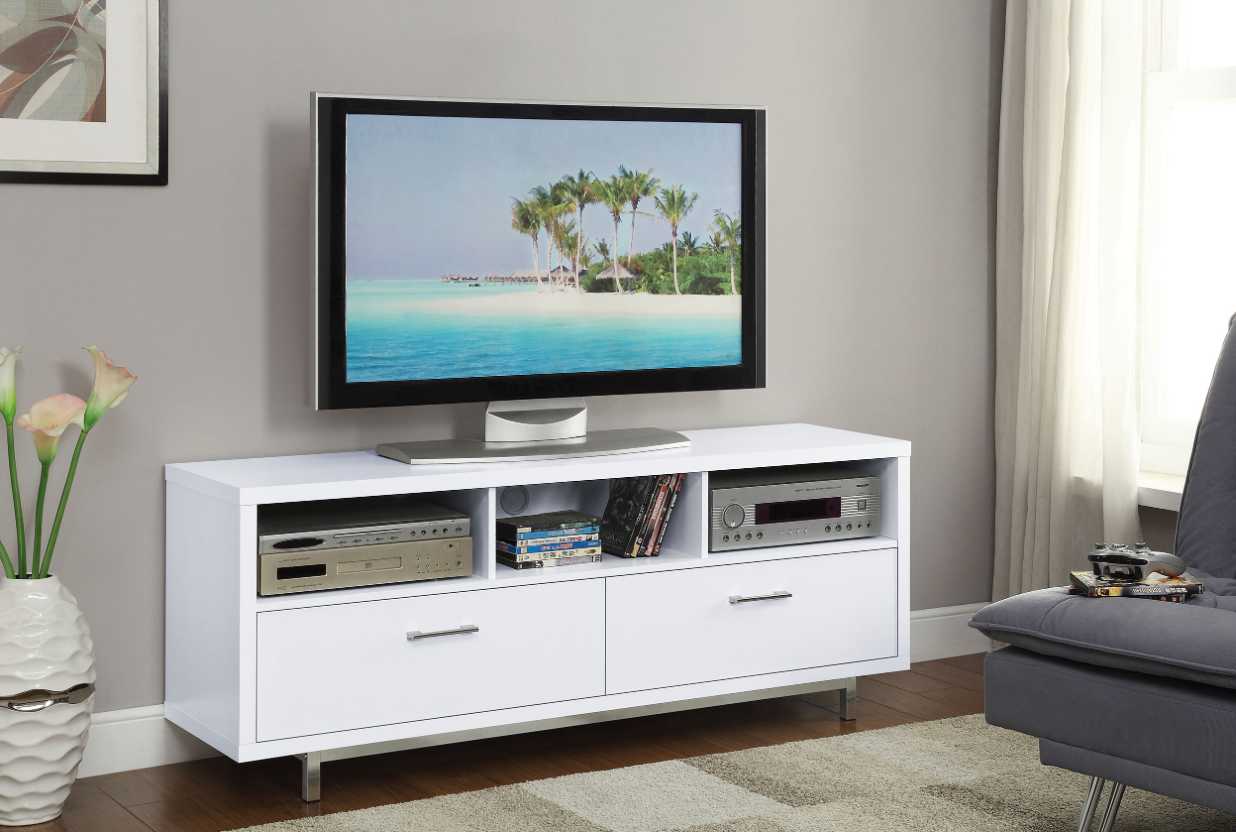 A living room with a white entertainment center and a flat screen tv