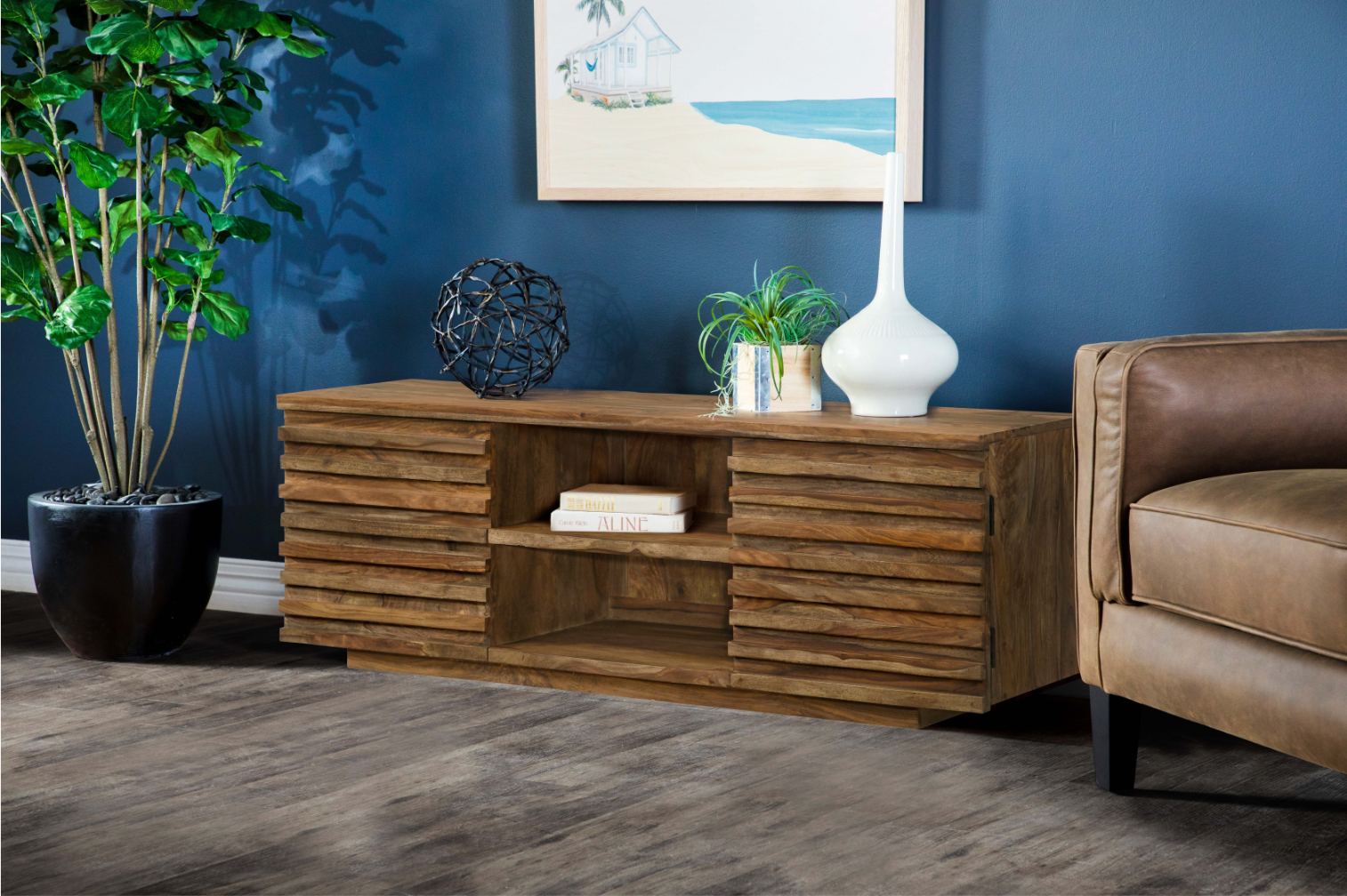 A living room with a wooden entertainment center and a chair.