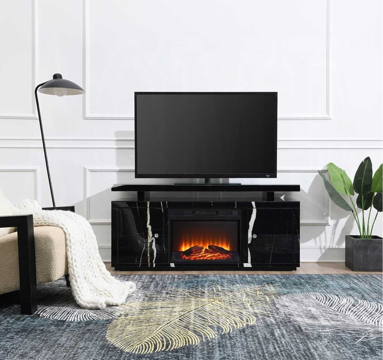 A living room with a fireplace and a flat screen tv