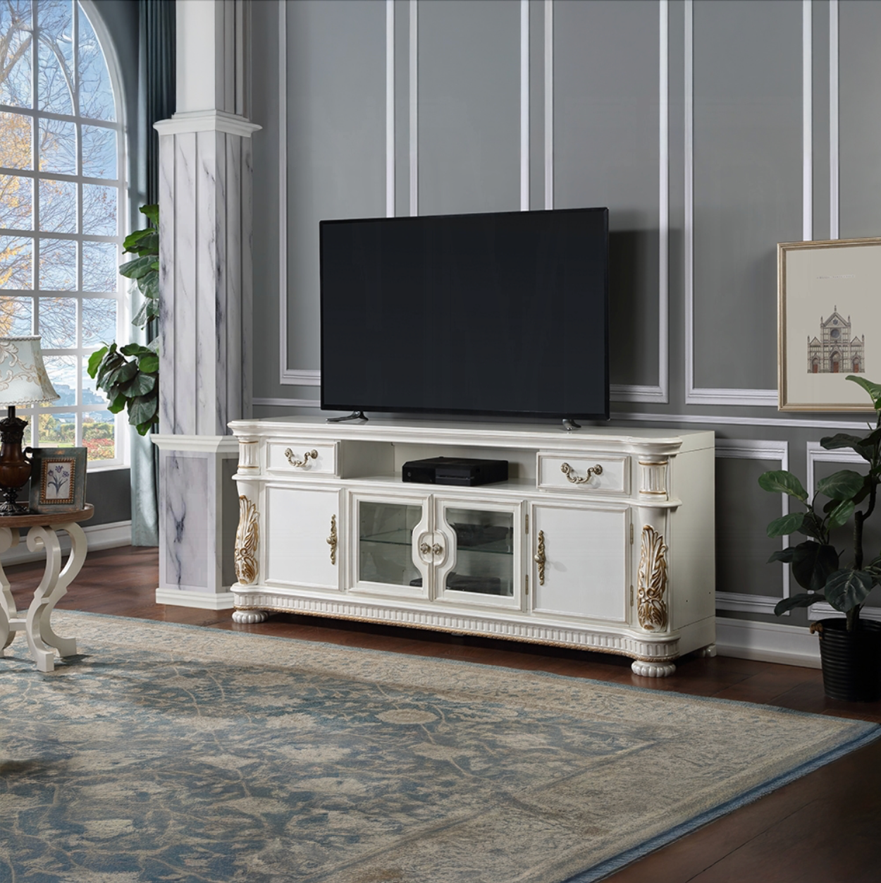 A living room with a white entertainment center and a flat screen tv
