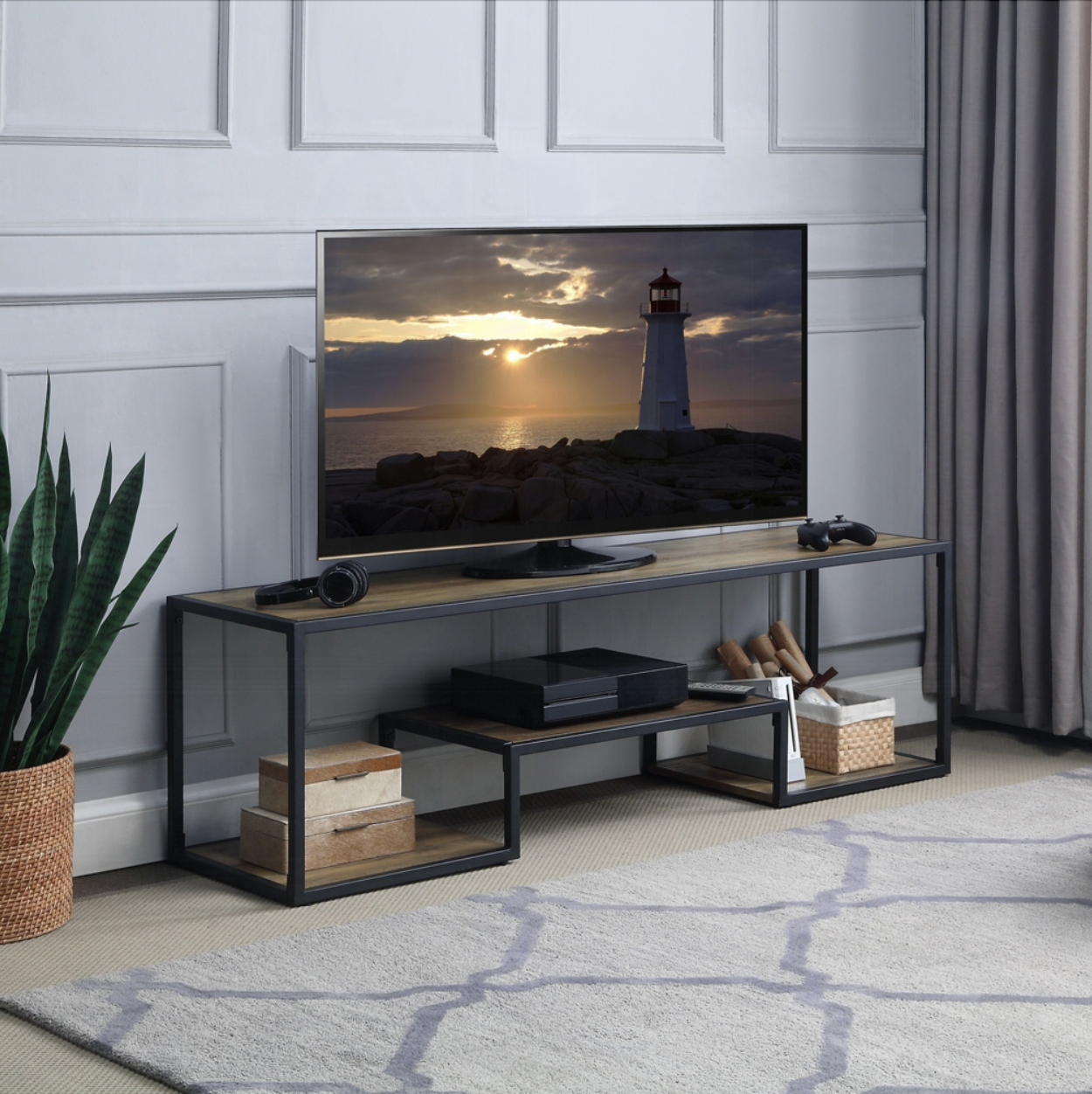 A living room with a flat screen tv on a stand