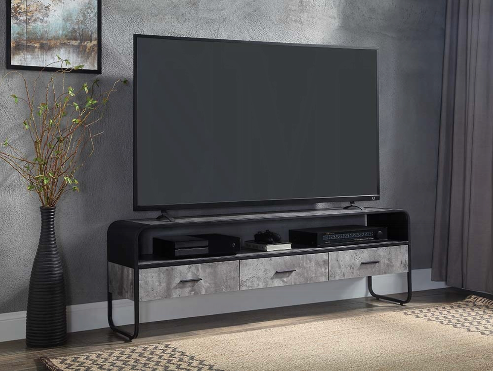 A flat screen tv is sitting on top of a tv stand in a living room.