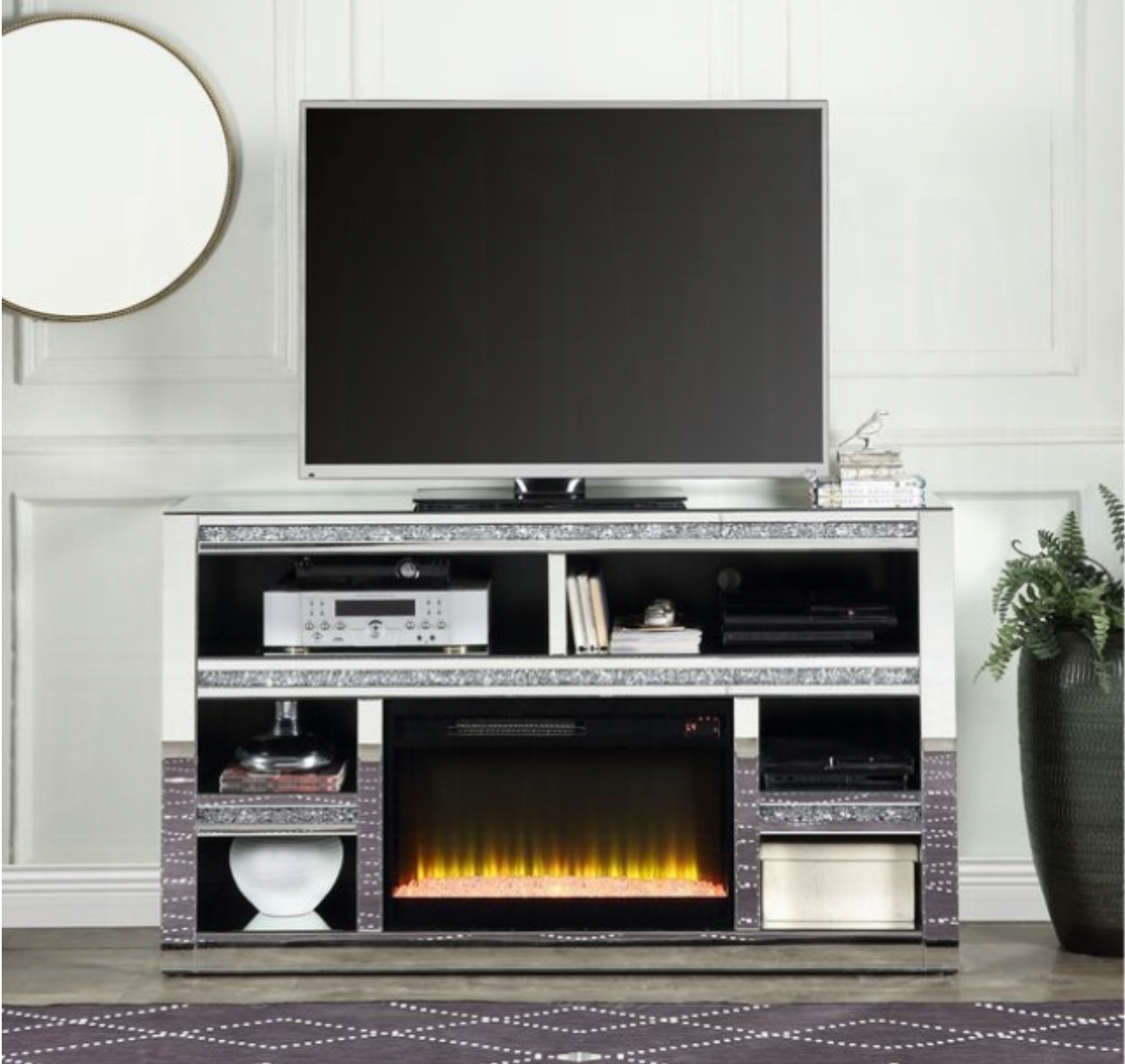 A tv stand with a fireplace and a flat screen tv