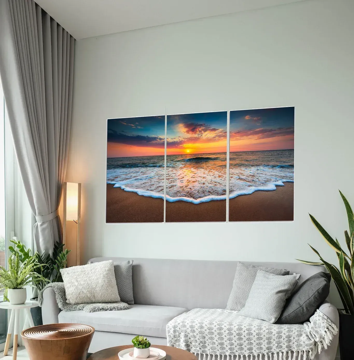 A living room with a couch and a painting on the wall