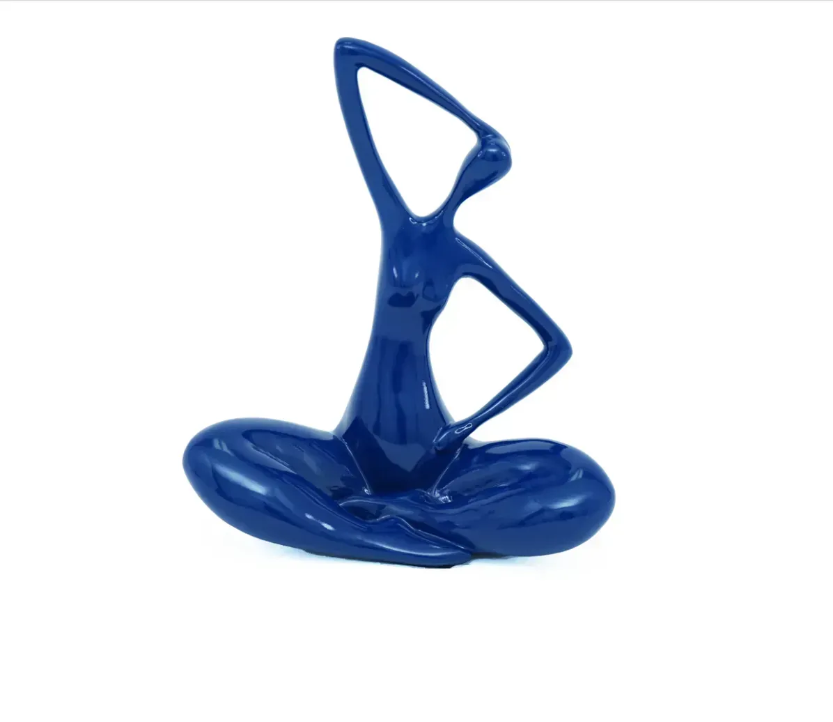 A blue statue of a woman sitting in a lotus position