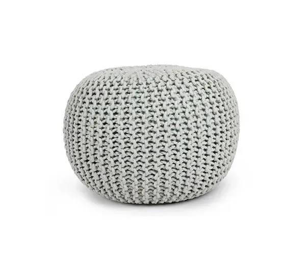 A white knitted ottoman on a white background