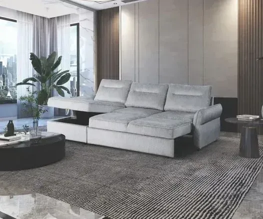 A living room with a white sectional couch and a coffee table.