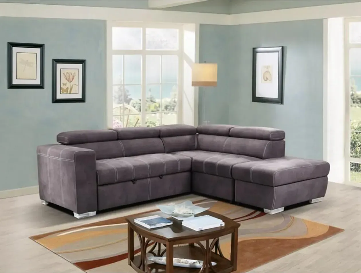 A living room with a sectional couch and a coffee table