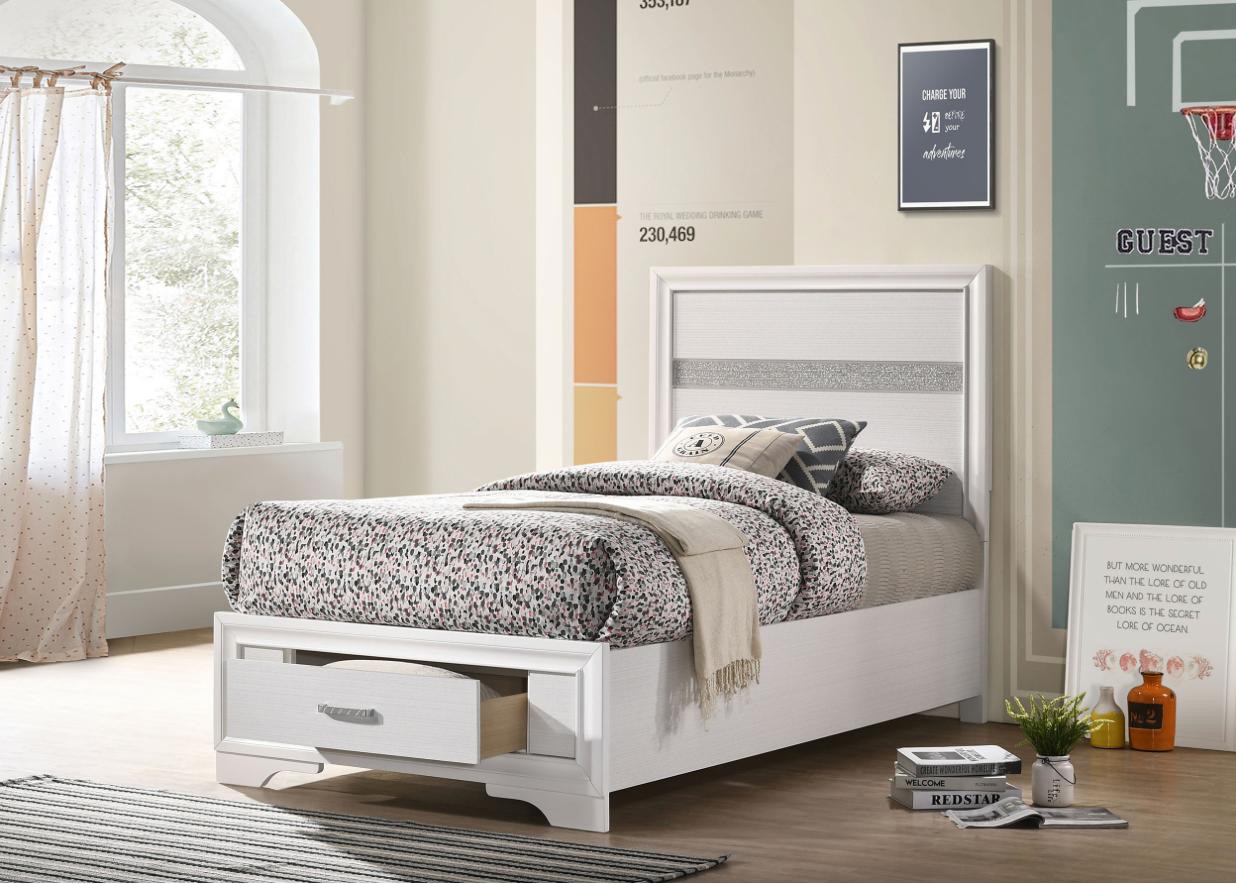 A white bed with a drawer underneath it in a bedroom.