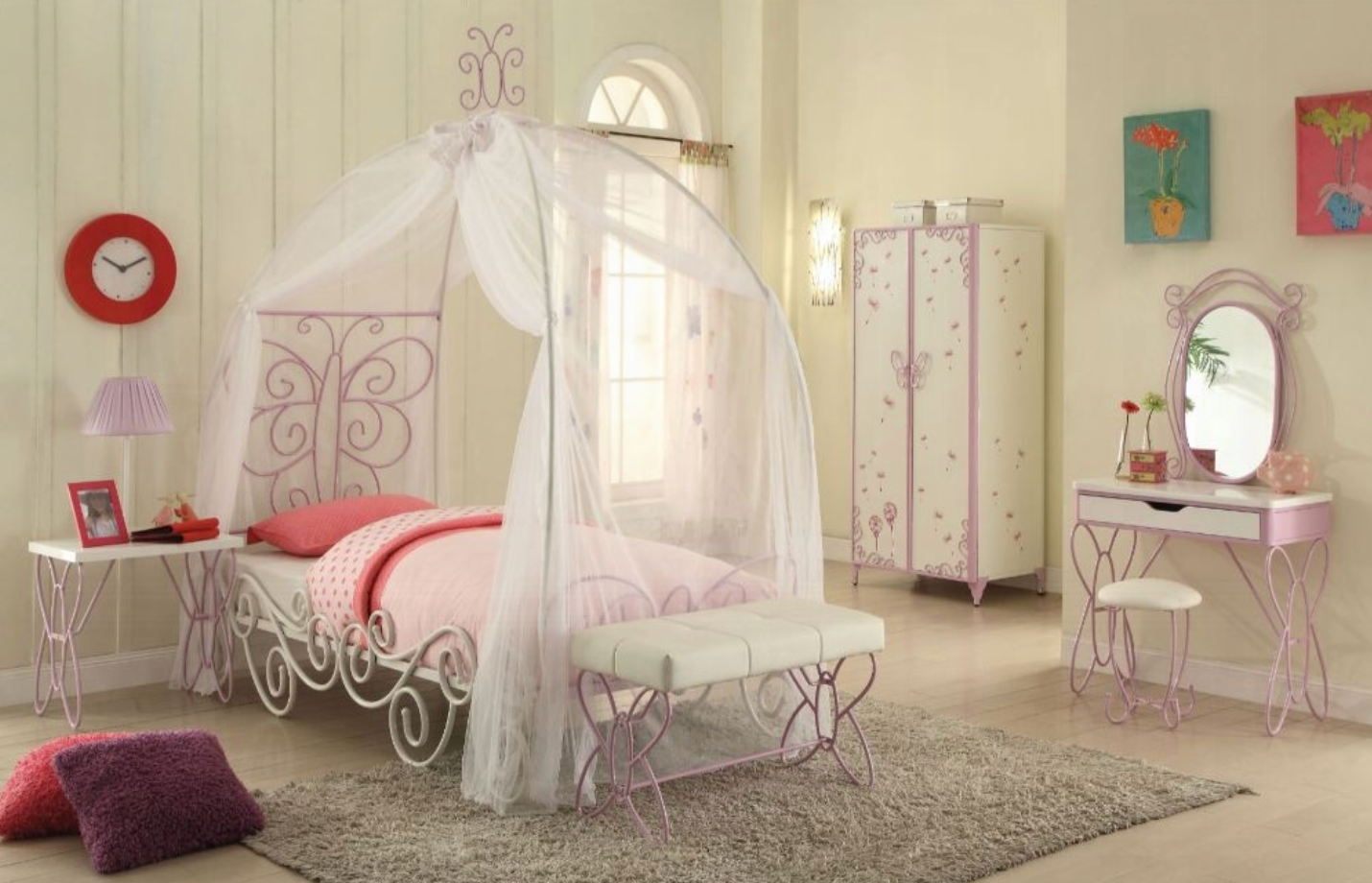 A bedroom with a canopy bed and a dresser
