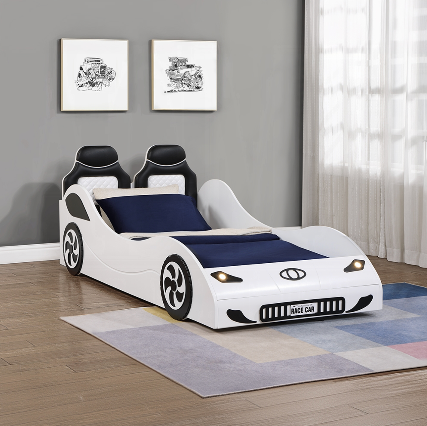 A white car bed is sitting on a rug in a room.