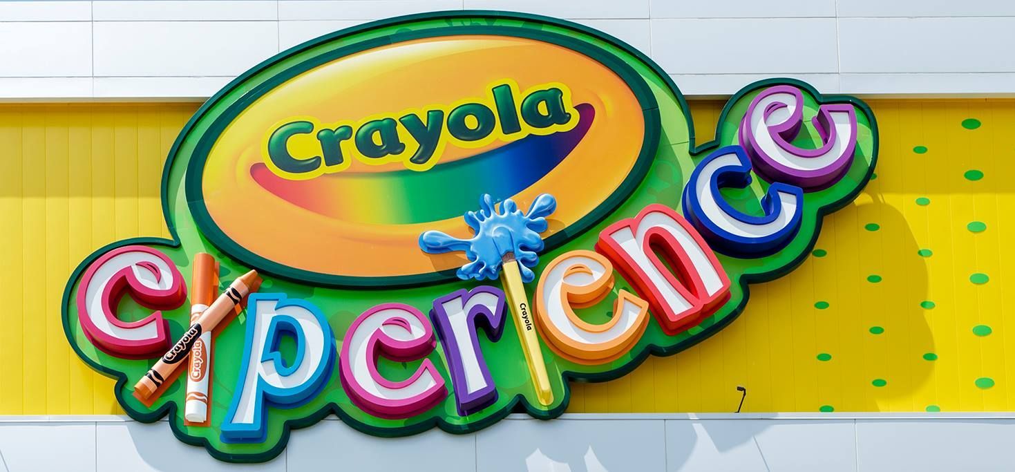 Crayola Experience sign with colorful lettering and logo.