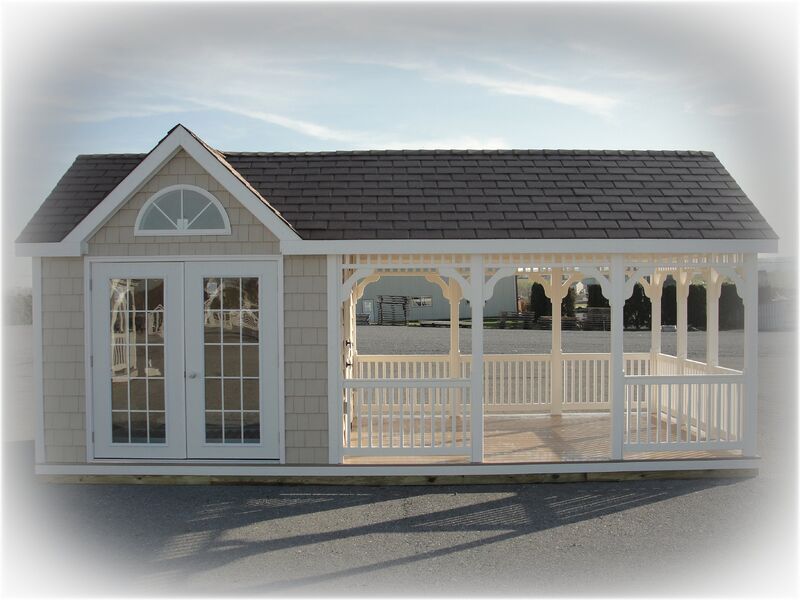 A small house with a gazebo attached to it