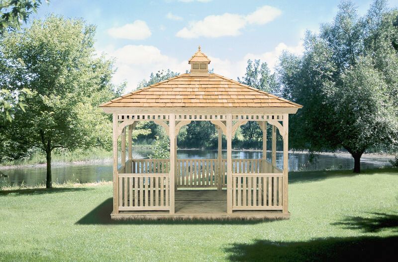 A gazebo is sitting in the middle of a lush green field