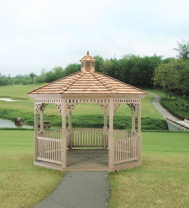 A wooden gazebo sits in the middle of a grassy field