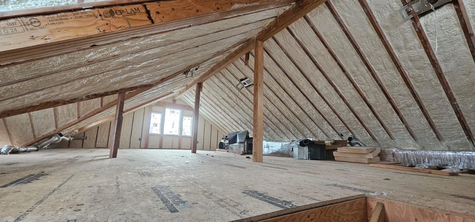 The attic of a house is being remodeled and insulated.