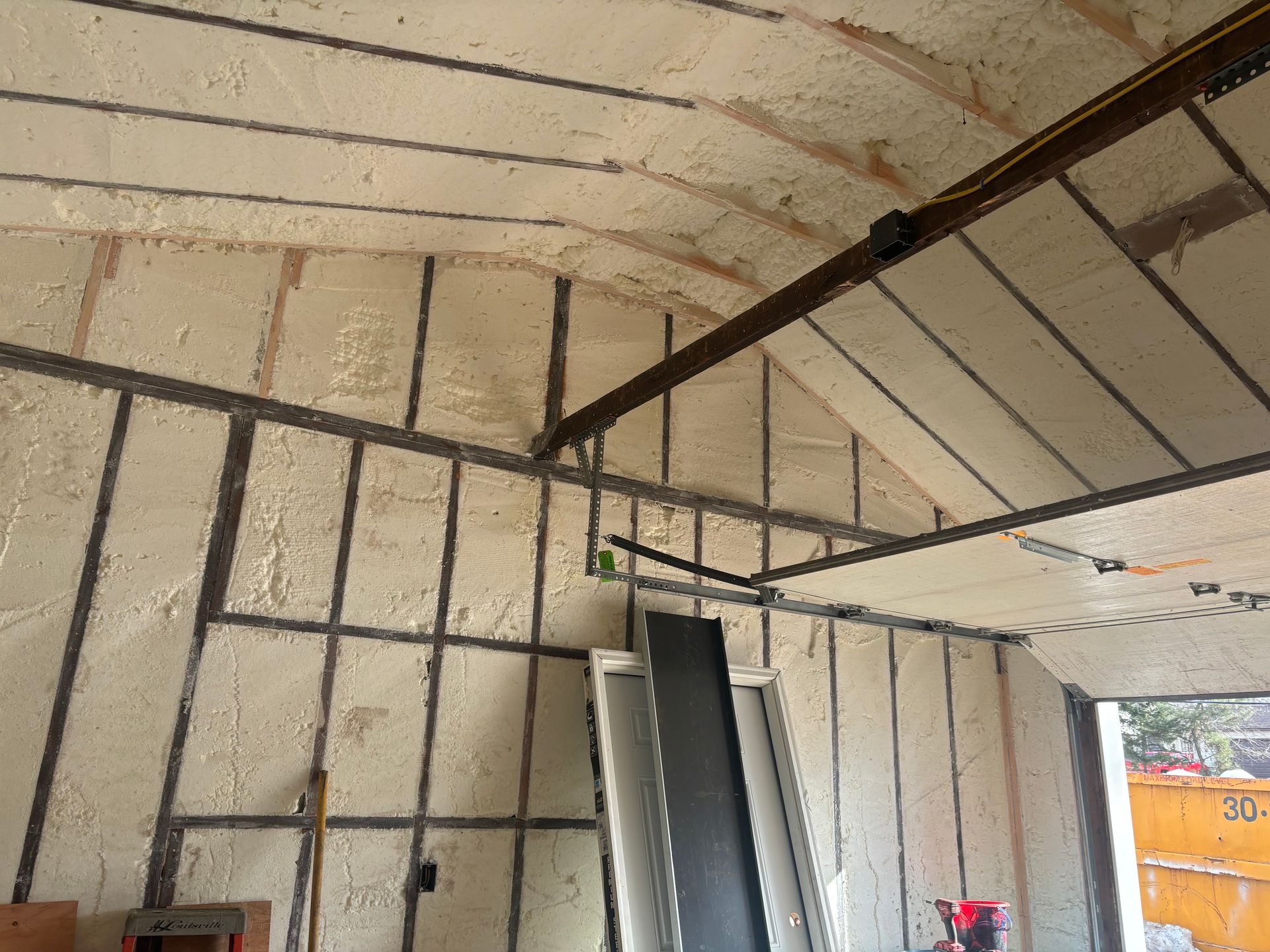 A garage with a lot of foam on the walls and ceiling.