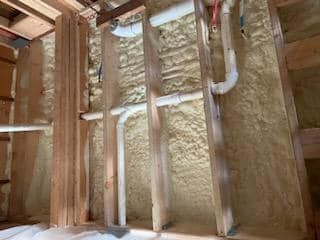 A room with a lot of pipes coming out of the ceiling.