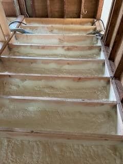 A wooden floor with a lot of foam on it.