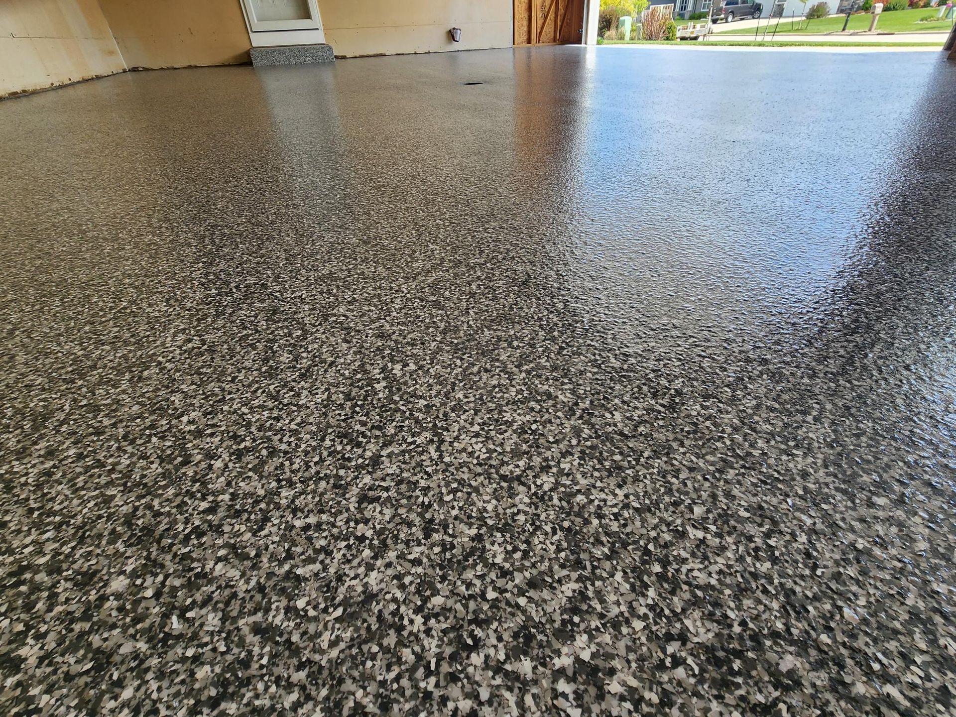 A close up of a shiny concrete floor in a garage.