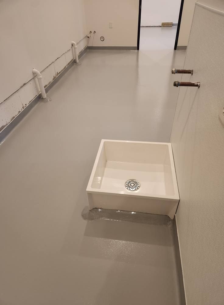 There is a sink in the middle of the room.