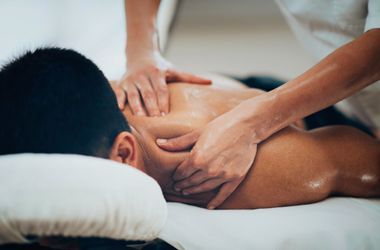 A man is getting a massage at a spa.