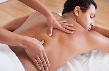 A man is getting a massage at a spa.