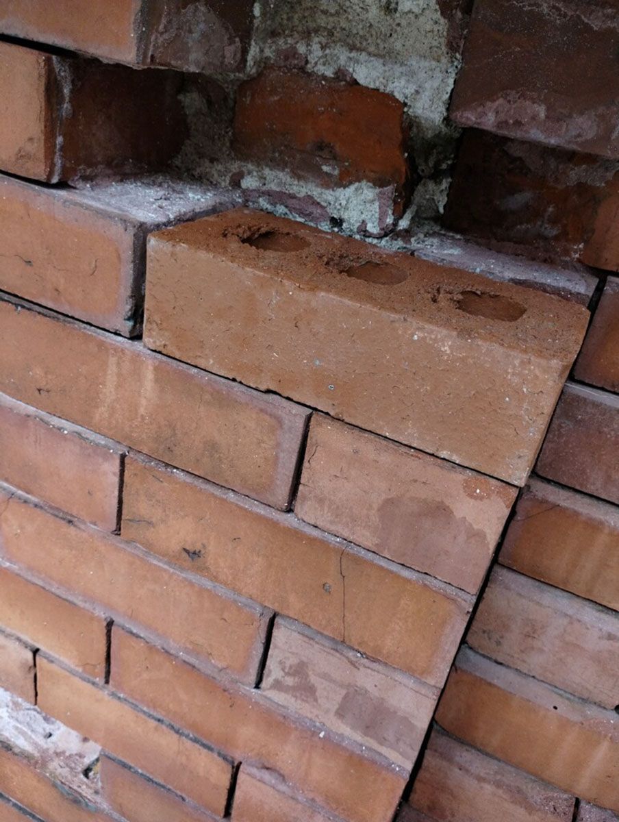 A close-up of a brick wall with bricks stacked on top of each other