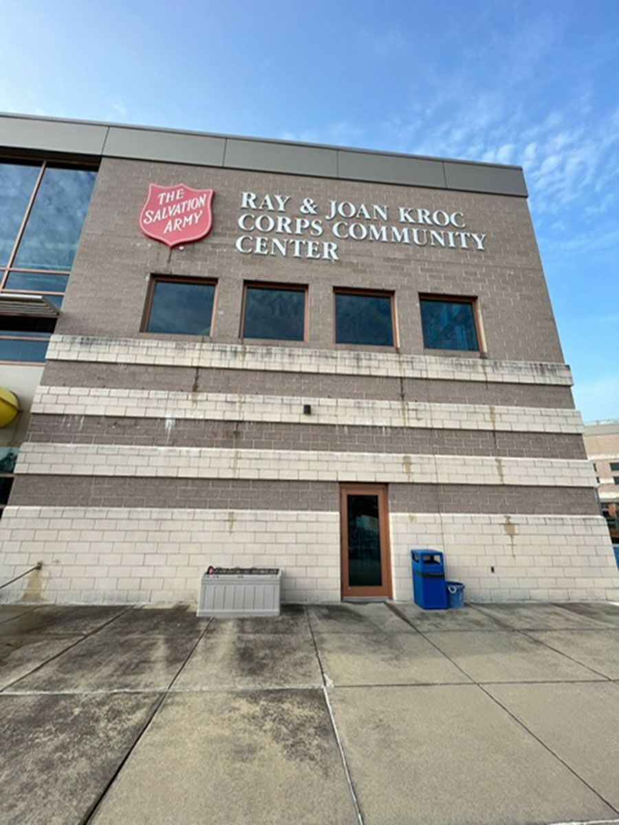 A building with a sign that says Ray & Joan Kroc Corps Community Center