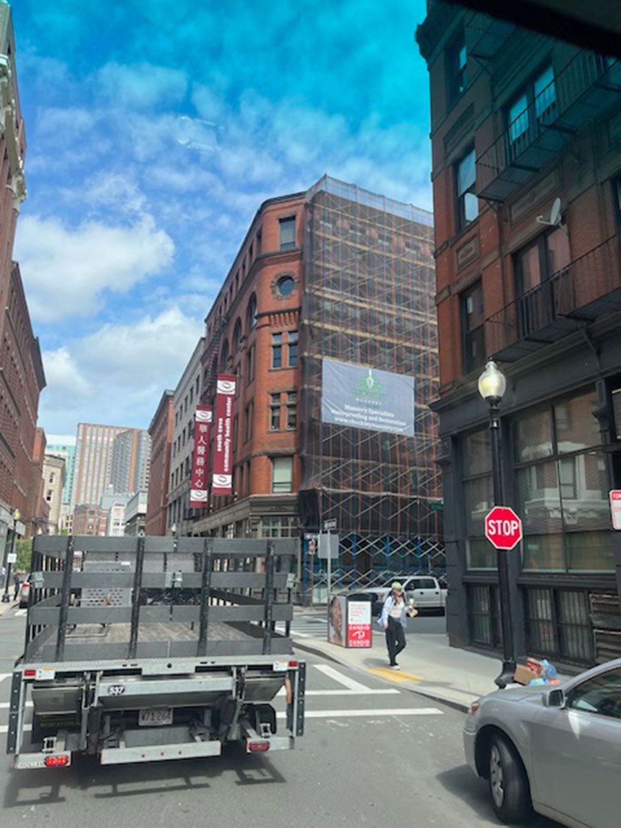 A stop sign is in the middle of a city street