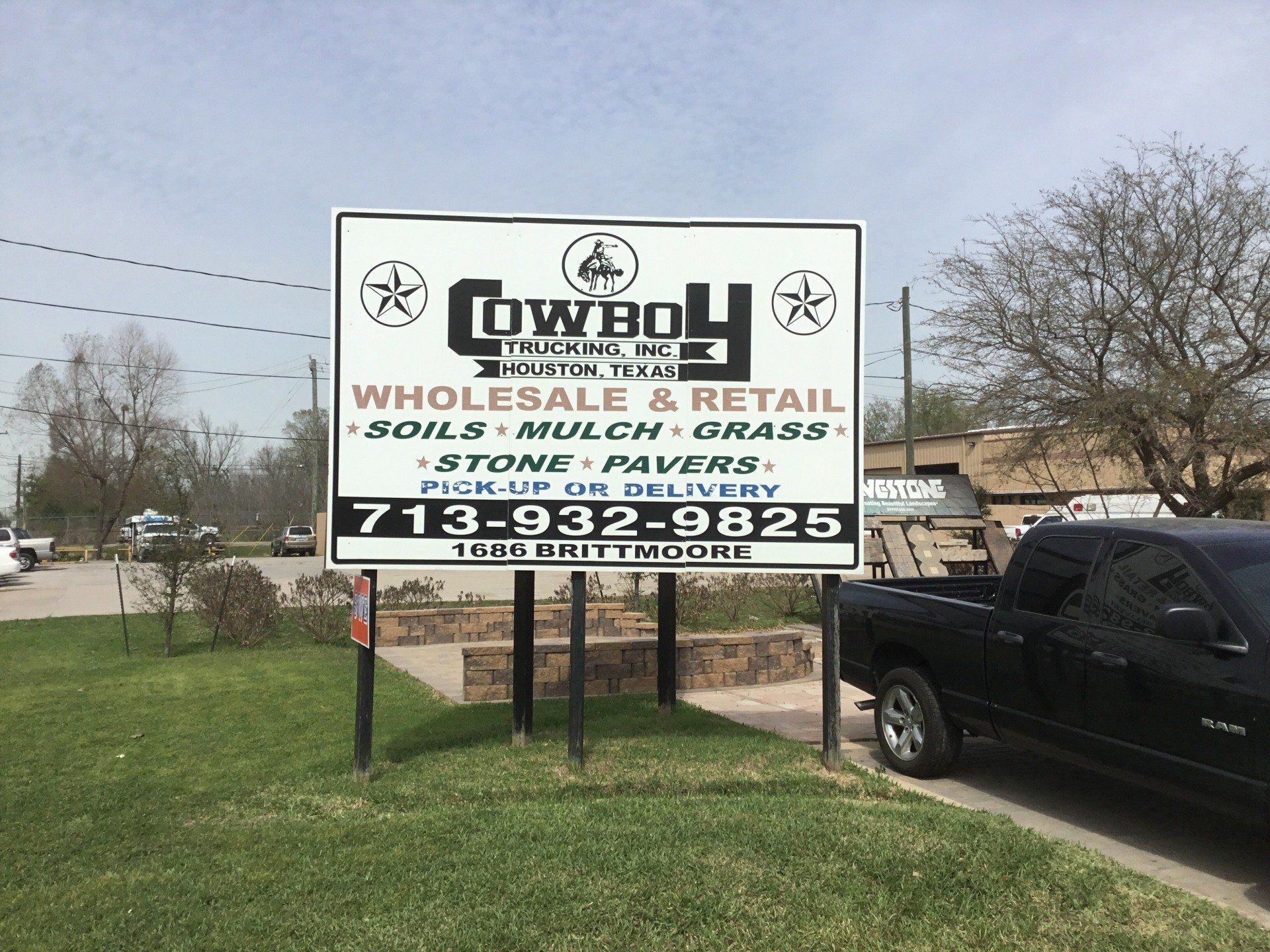 Cowboy Trucking Inc sign board