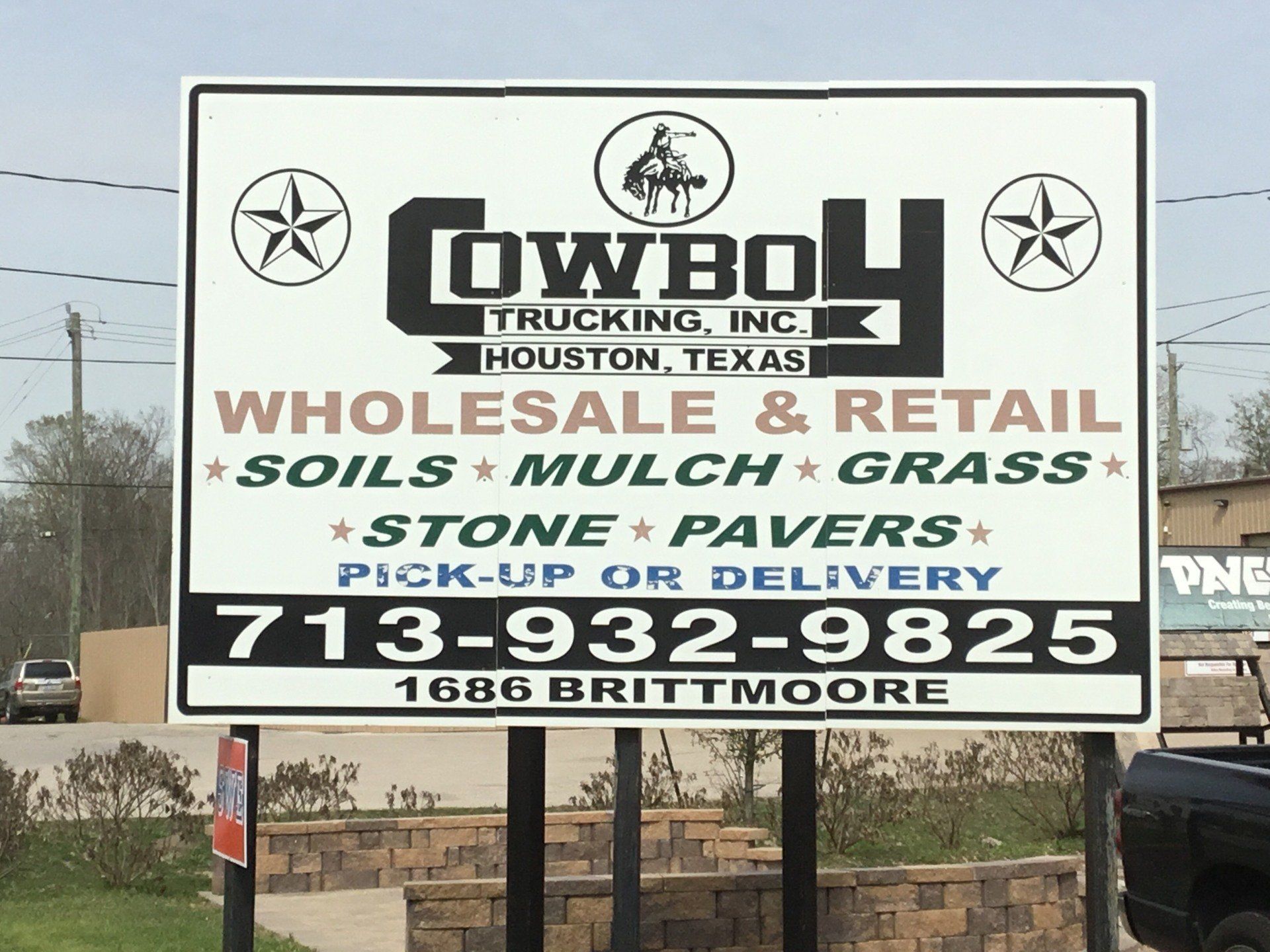Cowboy Trucking Inc sign board