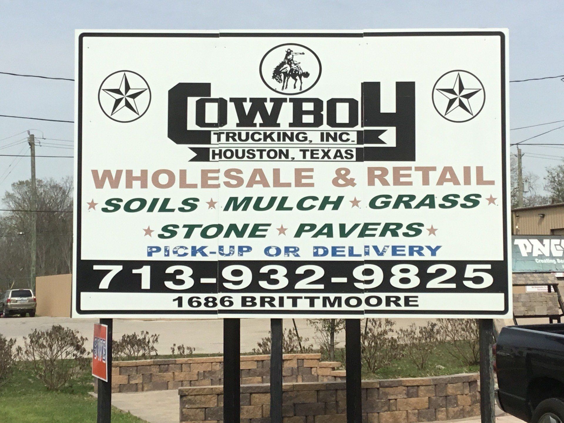 Cowboy Trucking Inc sign board