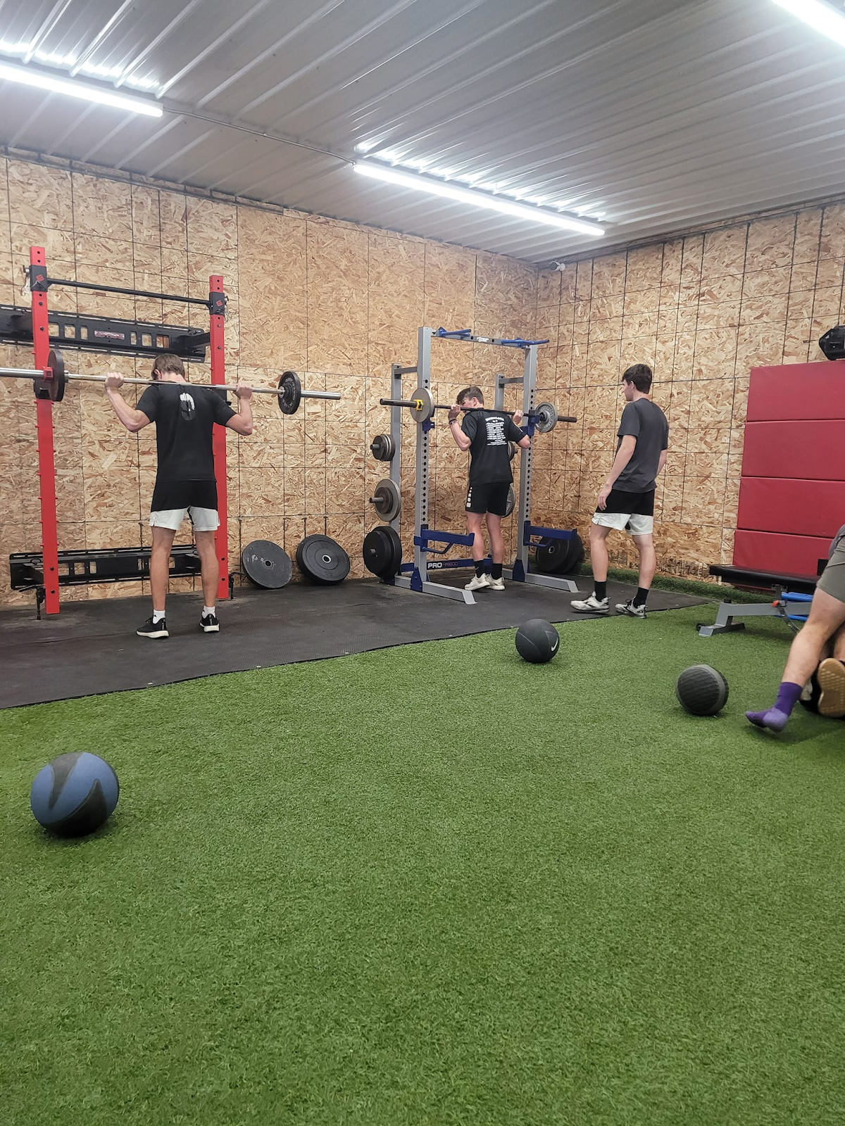 A group of people are working out in a gym.