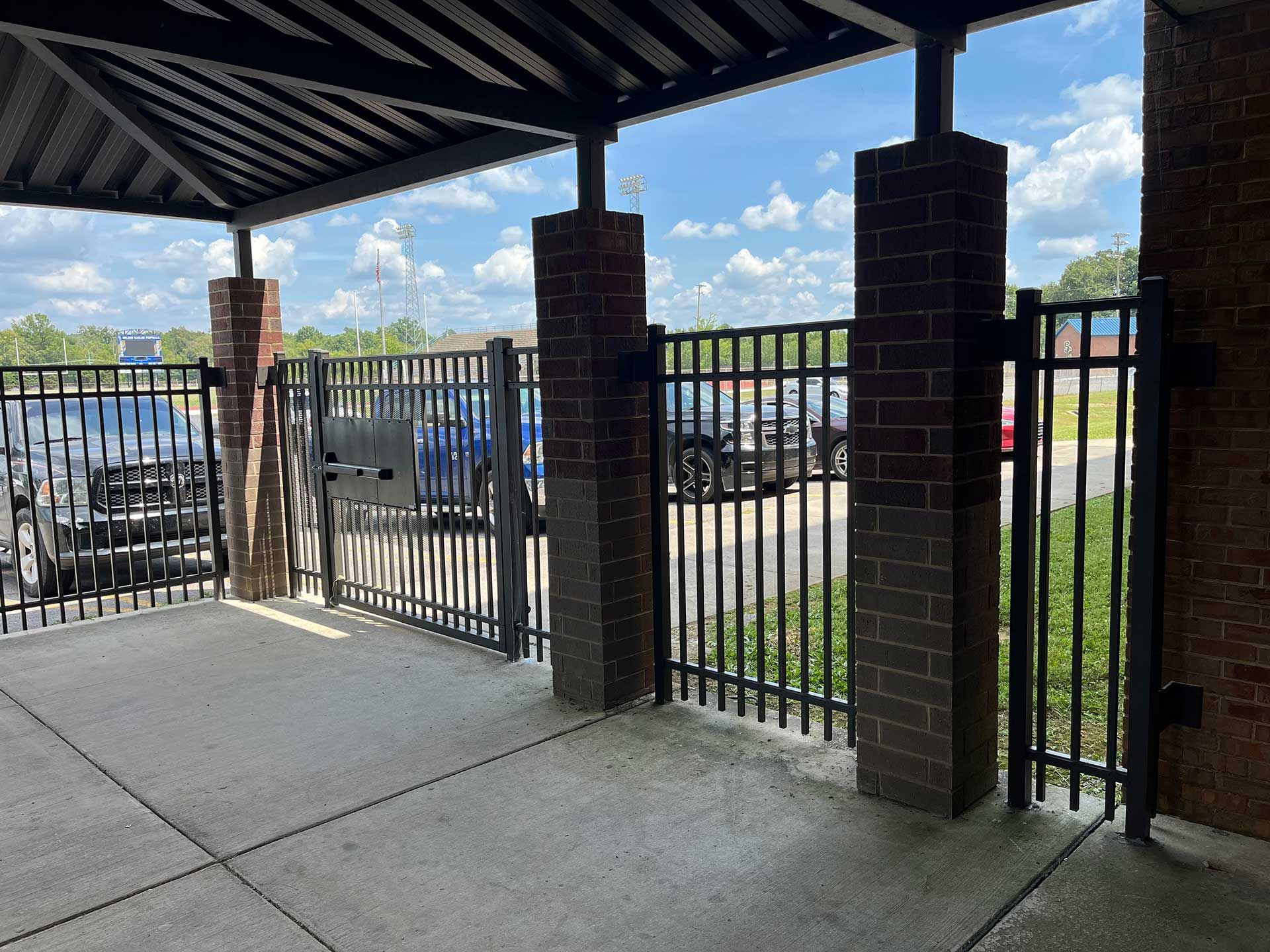 commercial fencing with brick posts