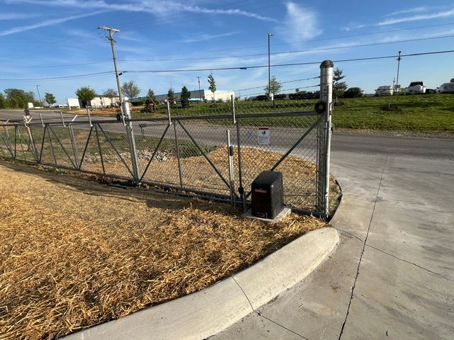 A sliding gate with a motor attached to it