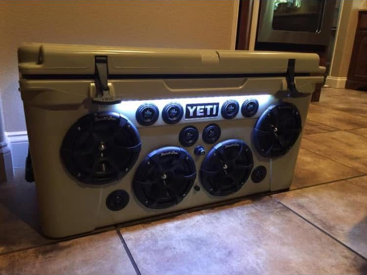 Tan Yeti cooler modified with multiple speakers and LED lights.