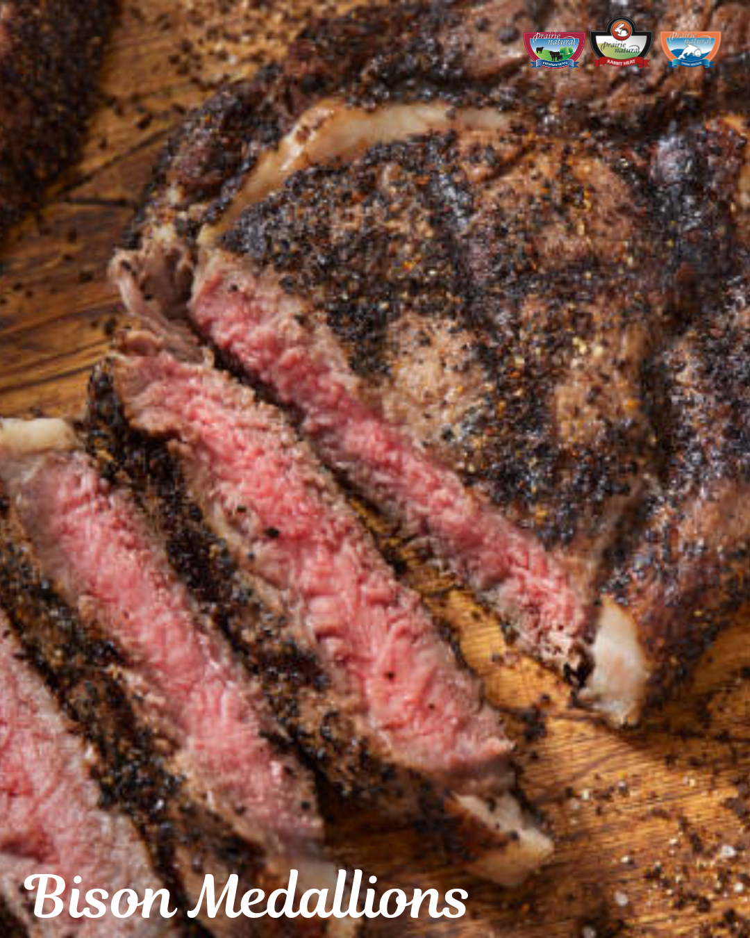Sliced bison medallions on a wooden cutting board, medium-rare, heavily seasoned with black pepper.